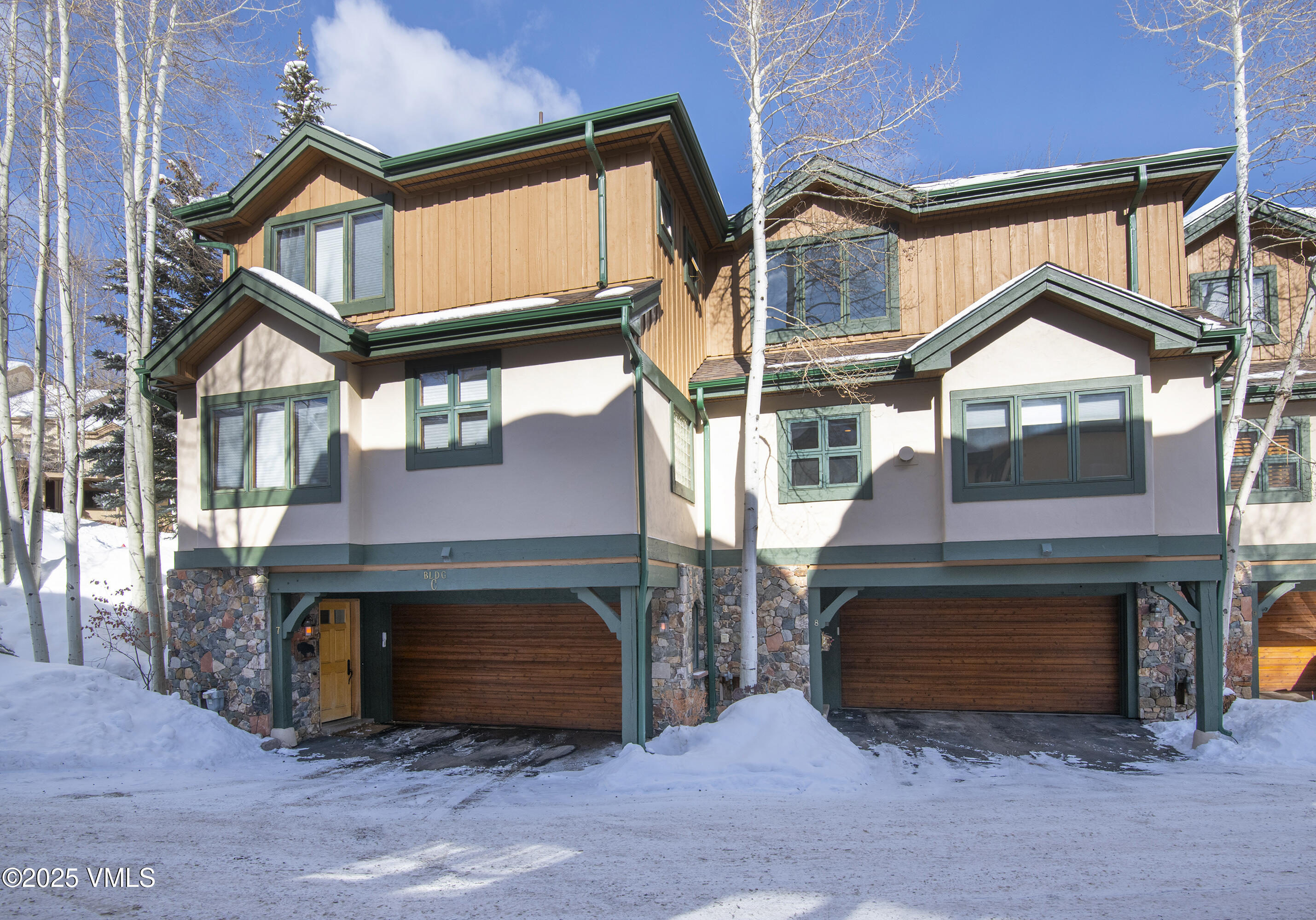 1890 Lions Ridge Loop, Unit 8 Vail, CO 81657 - Photo 34 of 39 a front view of a house with a yard