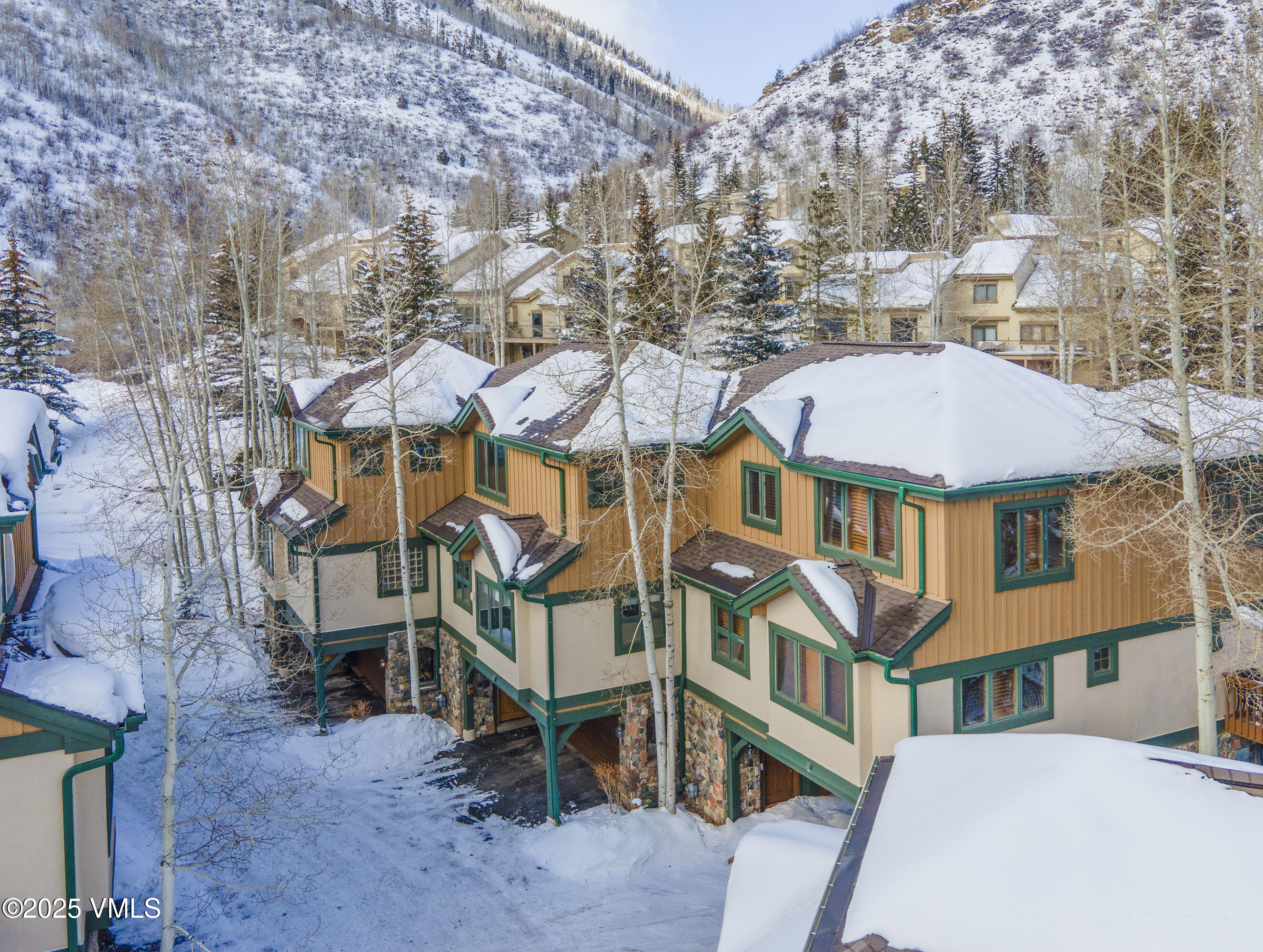1890 Lions Ridge Loop, Unit 8 Vail, CO 81657 - Photo 37 of 39 an aerial view of a residential apartment building with a yard and balcony
