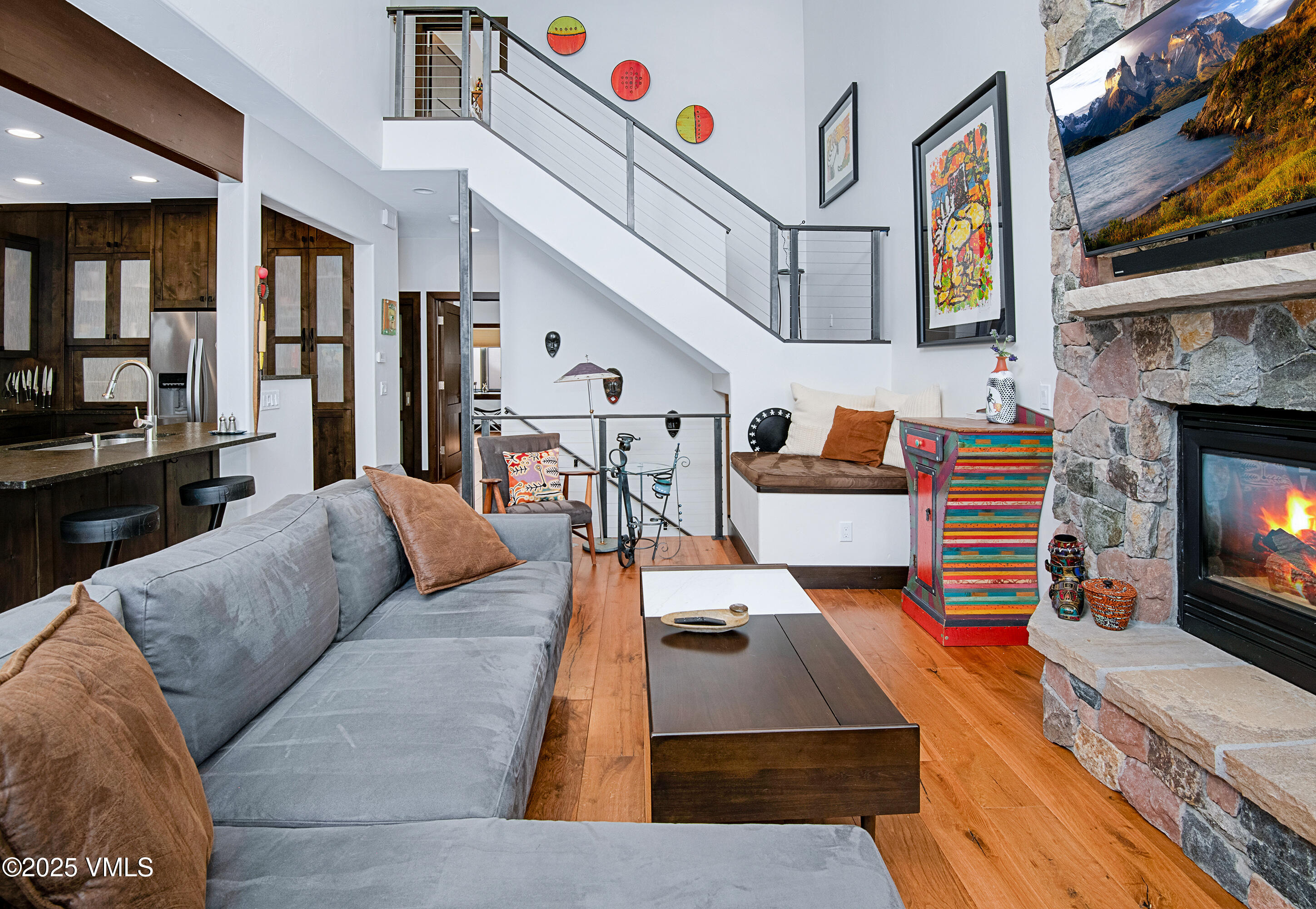 1890 Lions Ridge Loop, Unit 8 Vail, CO 81657 - Photo 4 of 39 a living room with furniture and a fireplace