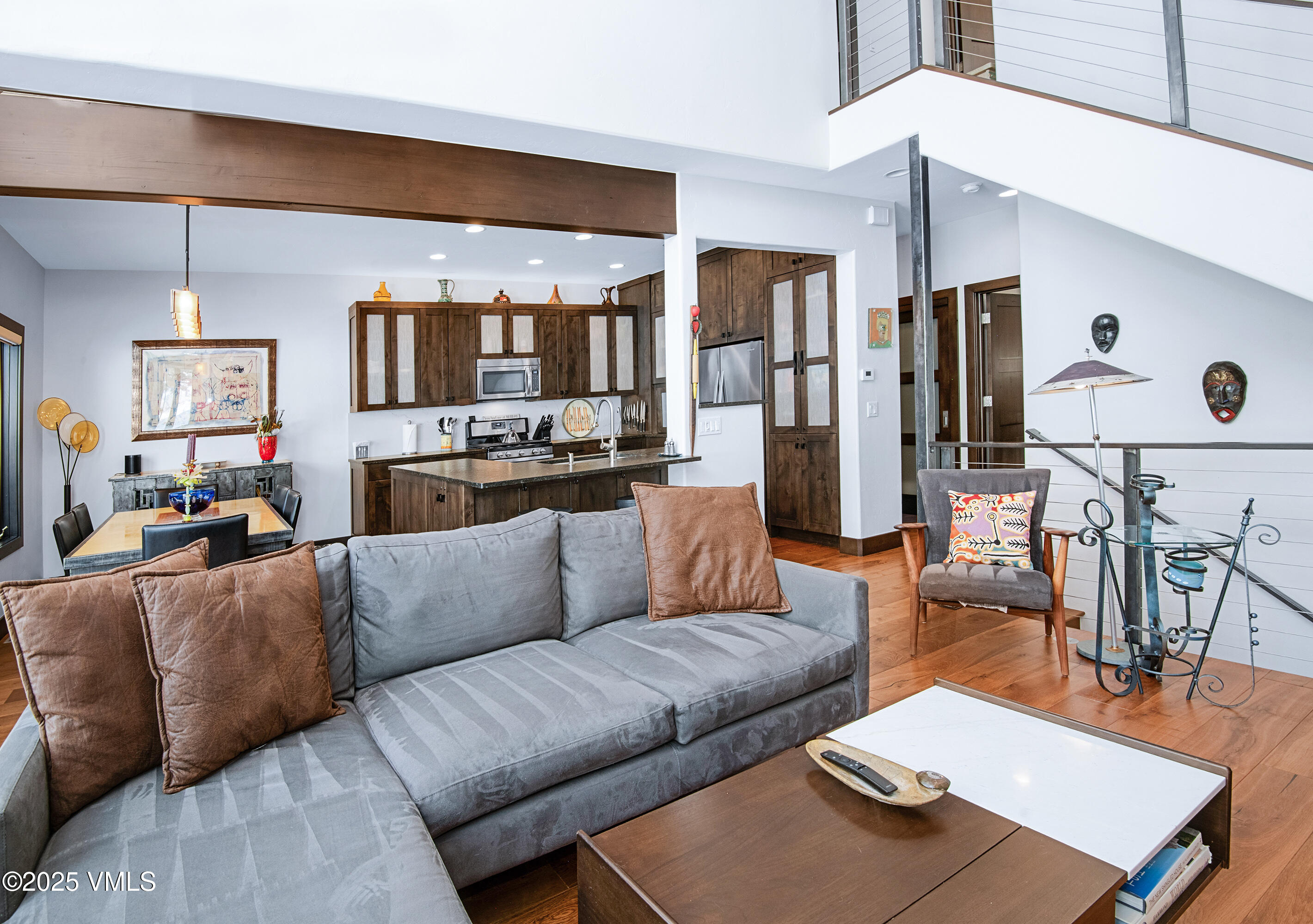 1890 Lions Ridge Loop, Unit 8 Vail, CO 81657 - Photo 5 of 39 a living room with furniture kitchen view and a large window