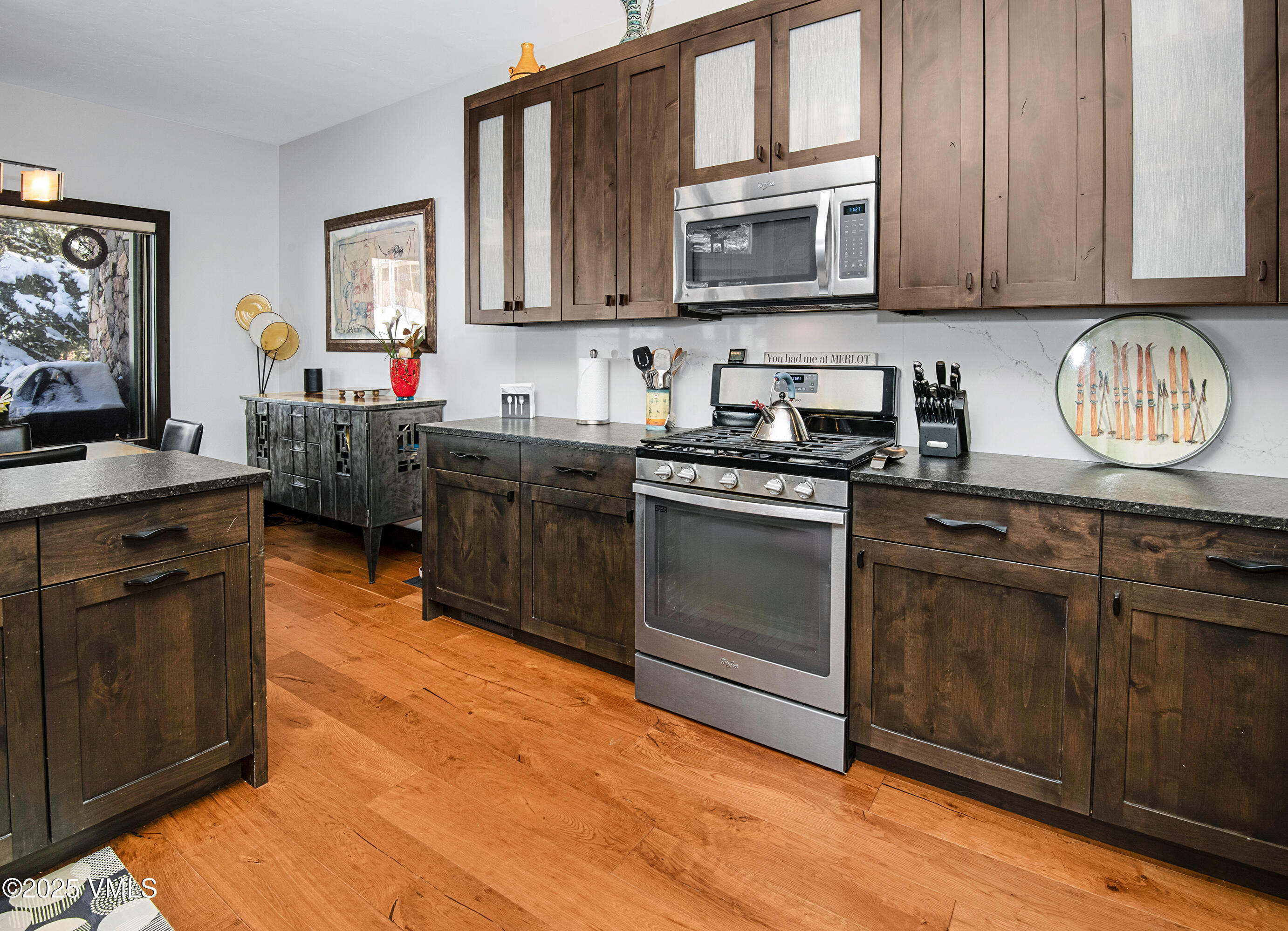 1890 Lions Ridge Loop, Unit 8 Vail, CO 81657 - Photo 8 of 39 a kitchen with stainless steel appliances granite countertop a stove sink and cabinets