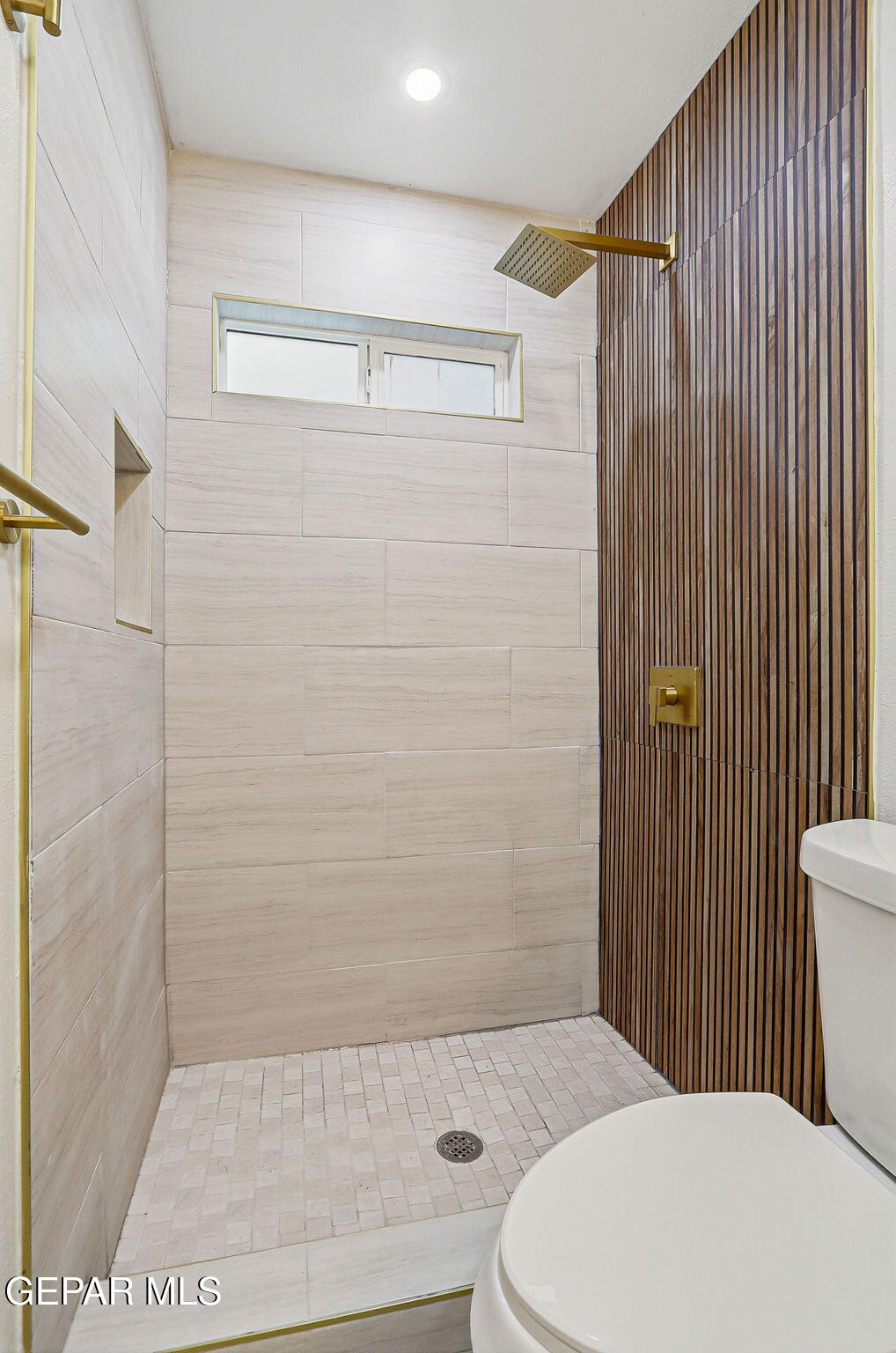 709 Frontera Road El Paso, TX 79922 - Photo 37 of 41 a bathroom with a toilet and shower