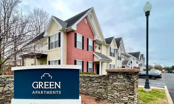 a view of a street with big house