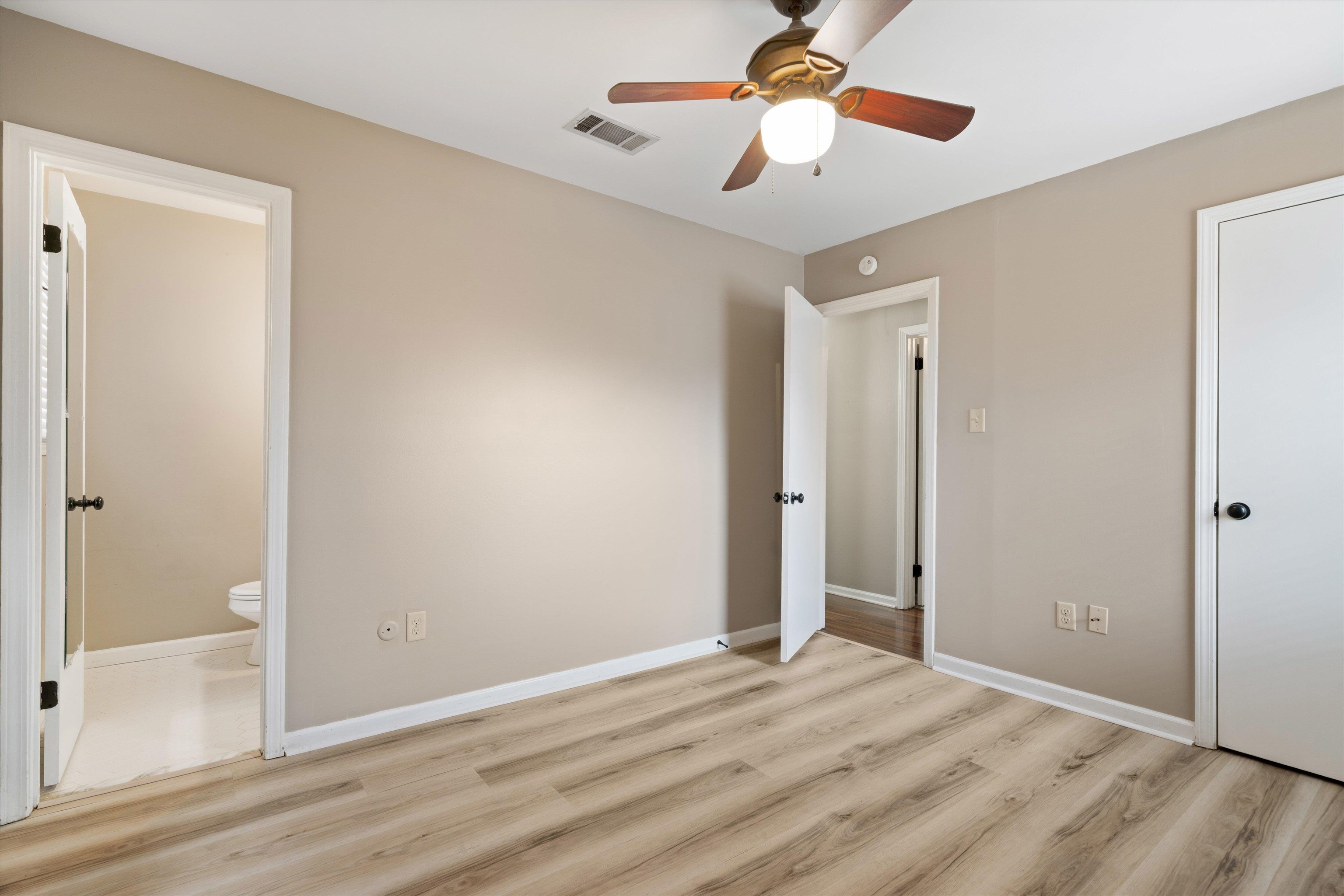 852 Greencliff Road Collierville, TN 38017 - Photo 11 of 17 an empty room with wooden floor fan and windows