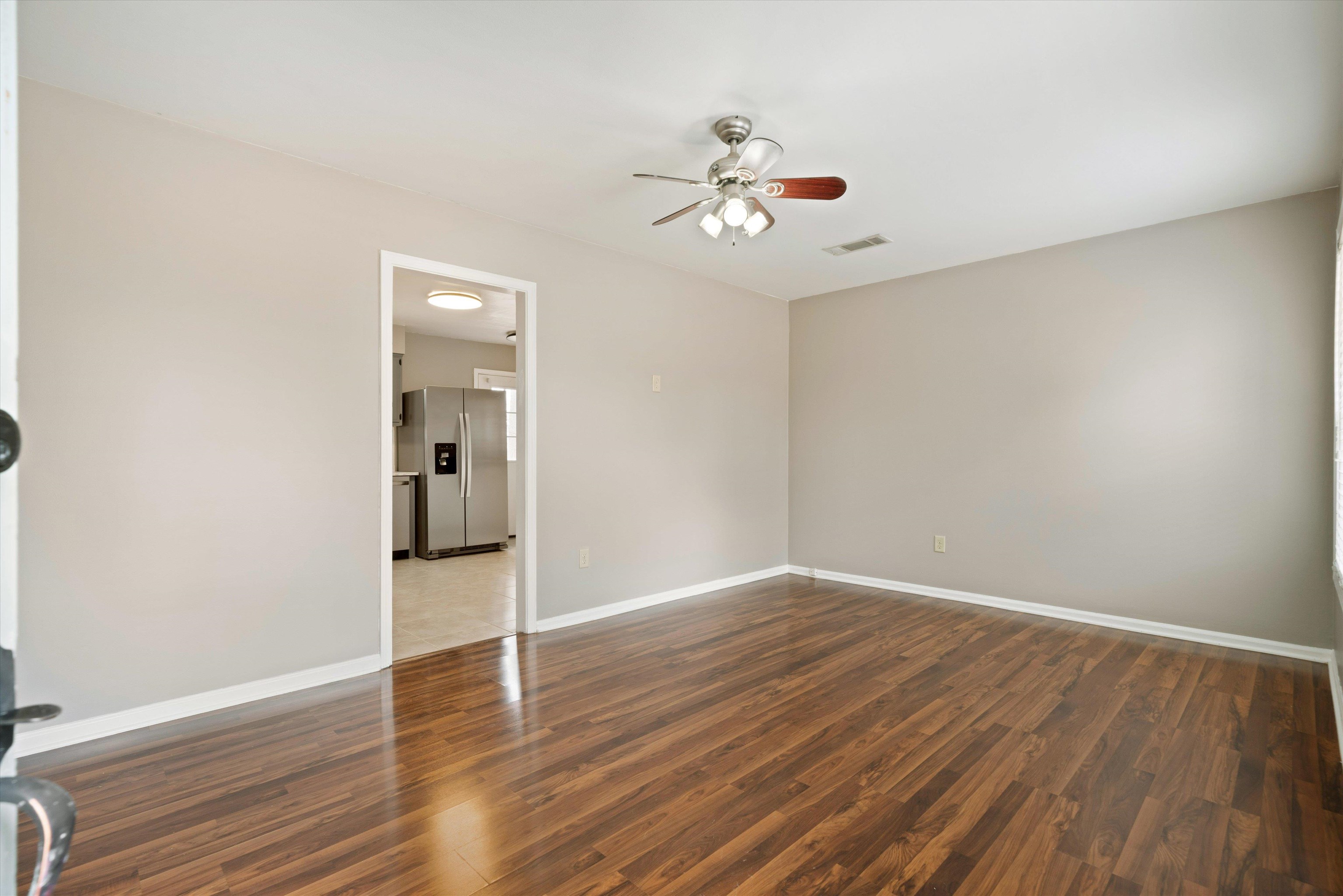 852 Greencliff Road Collierville, TN 38017 - Photo 3 of 17 wooden floor in an empty room with a window
