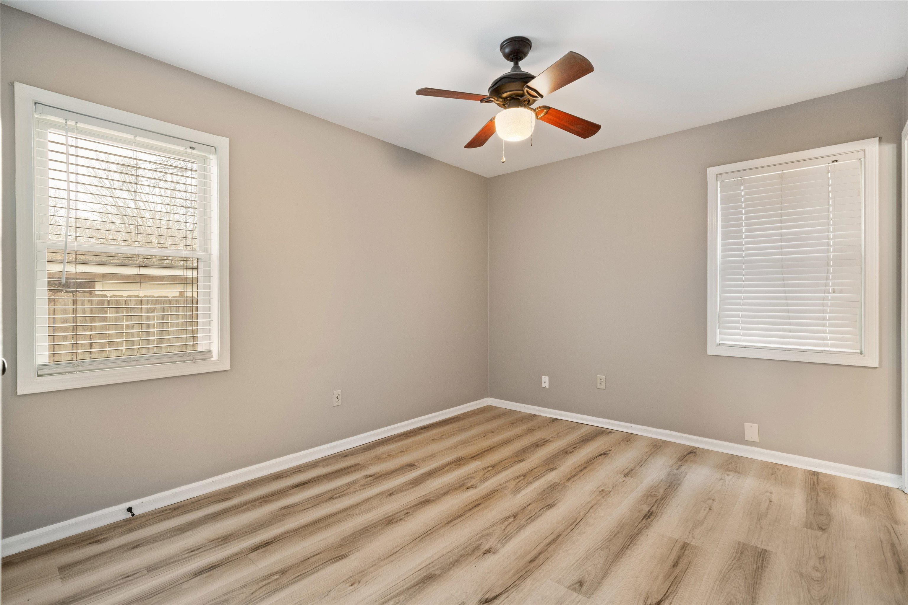852 Greencliff Road Collierville, TN 38017 - Photo 10 of 17 a view of empty room with wooden floor and fan