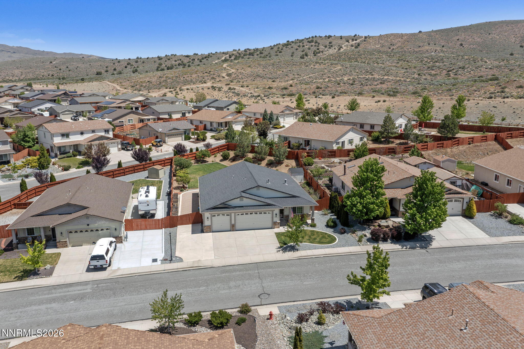 18324 Panda Bear Court Reno, NV 89508 - Photo 32 of 44 an aerial view of residential houses with outdoor space and mountain view