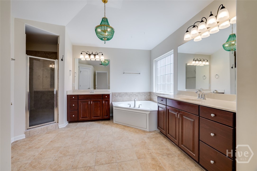 411 Plantation Place Rincon, GA 31326 - Photo 22 of 38 Primary bath with dual vanities, separate tub and shower