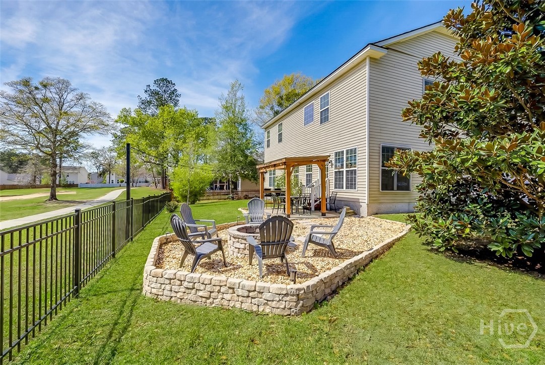 411 Plantation Place Rincon, GA 31326 - Photo 33 of 38 Entertainers back yard with pergola, fire pit overlooking the 7th hole of the golf course!