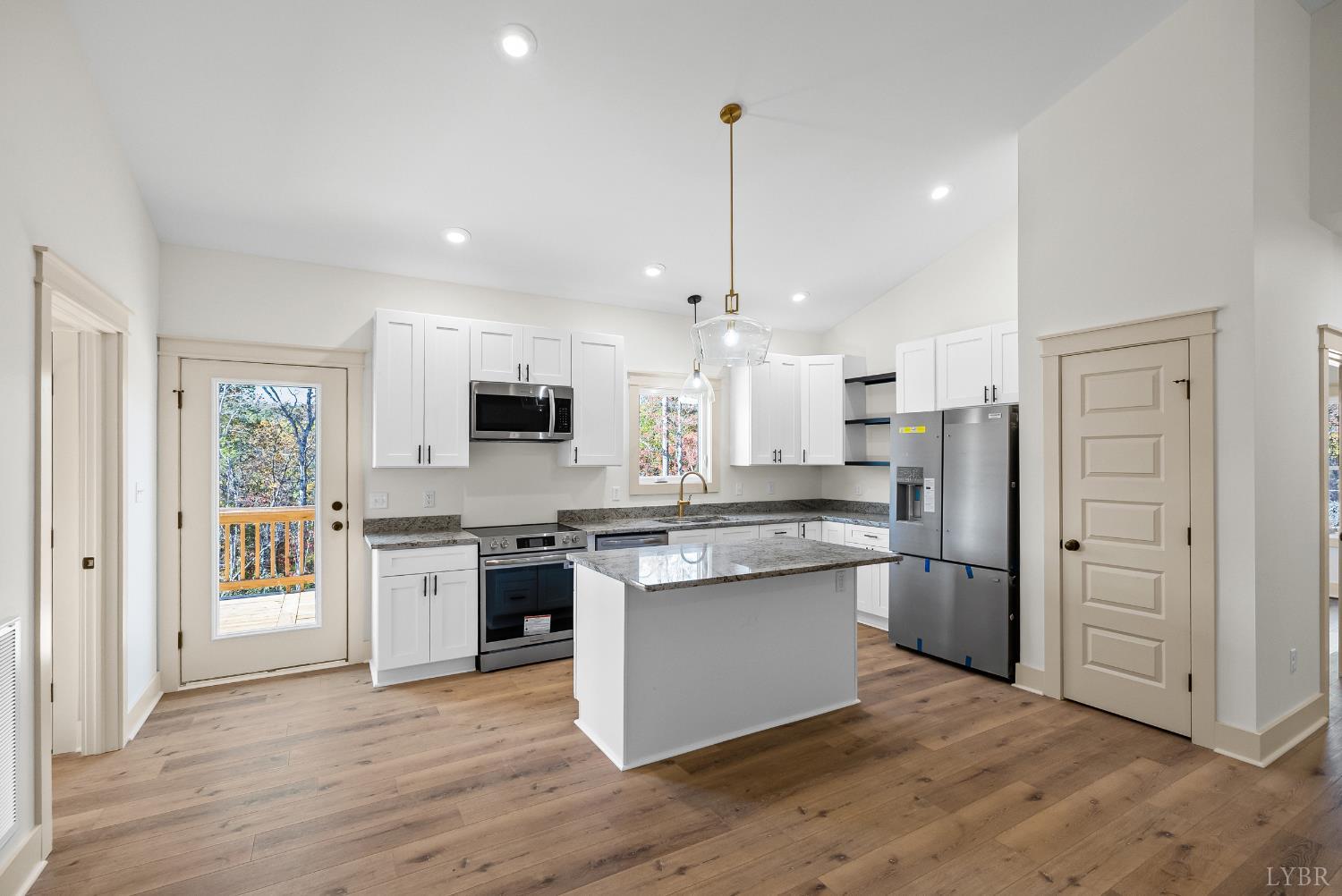 2180 Earley Farm Road Amherst, VA 24521 - Photo 13 of 35 a kitchen with stainless steel appliances granite countertop a stove top oven a refrigerator and a sink
