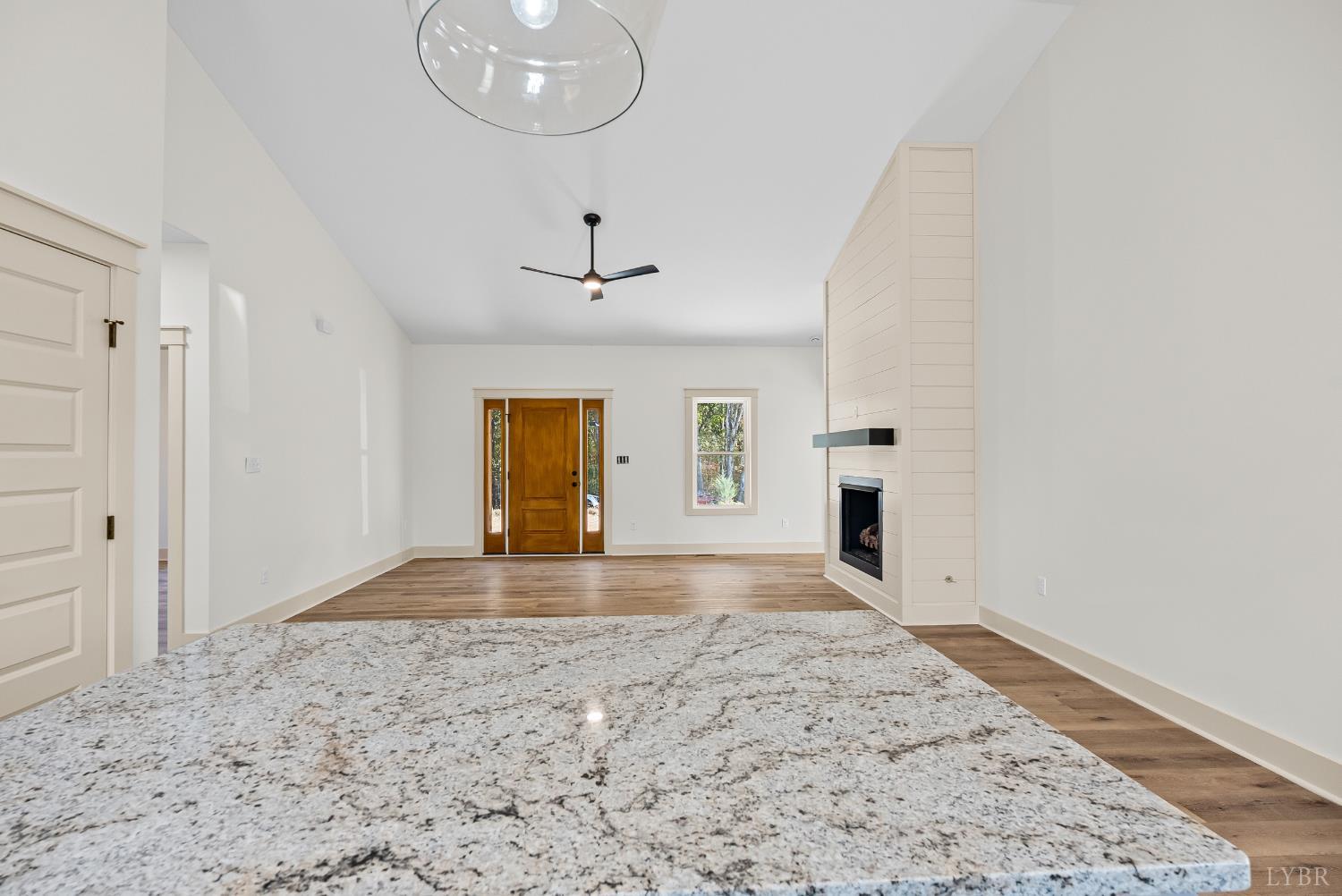 2180 Earley Farm Road Amherst, VA 24521 - Photo 19 of 35 a view of a livingroom with a chandelier and wooden floor