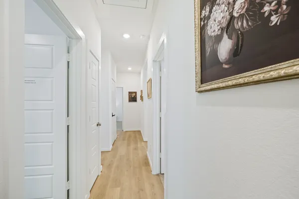 a bedroom with a bed and a night stand