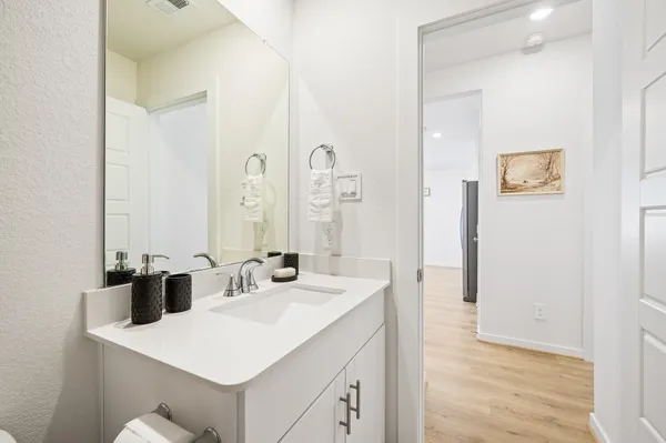a view of a patio with table and chairs and potted plants