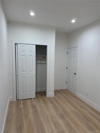 an empty room with closet area
