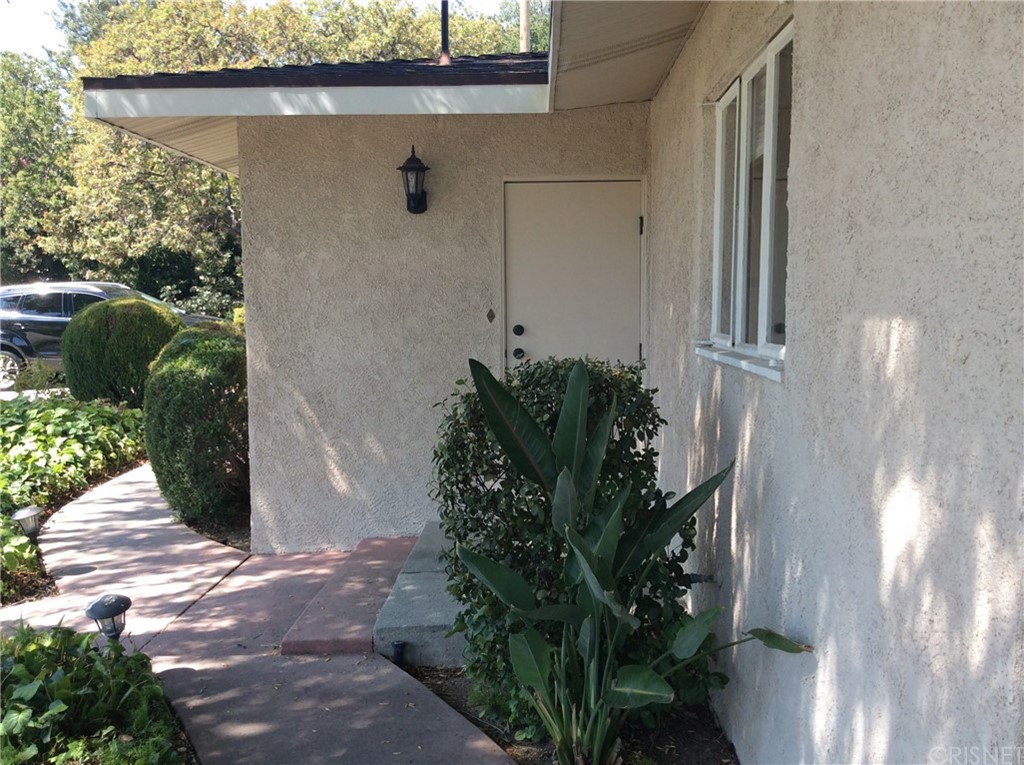 1635 Midwick Drive Altadena, CA 91001 - Photo 38 of 44 a potted plant sitting in front of a door