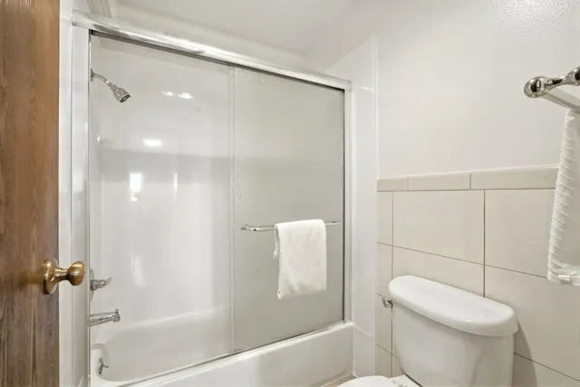 a view of washer and dryer with wooden floor