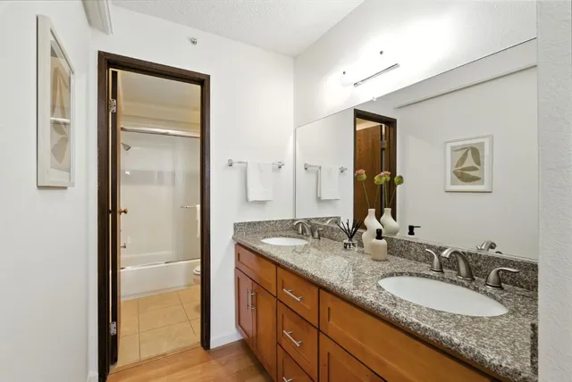 a bathroom with a shower and a mirror