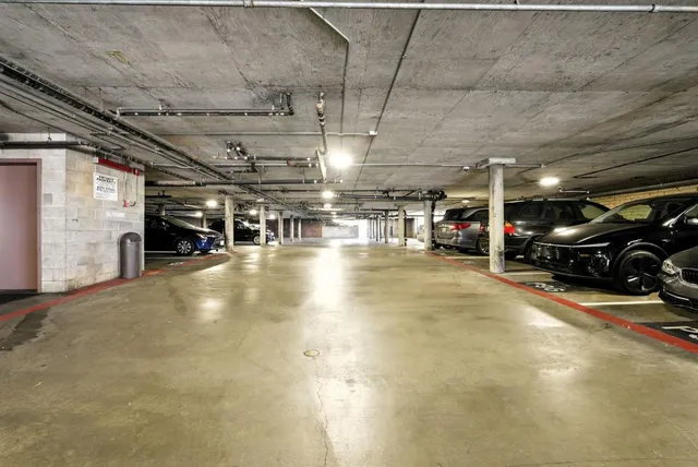 a room with gym equipment and view of living room