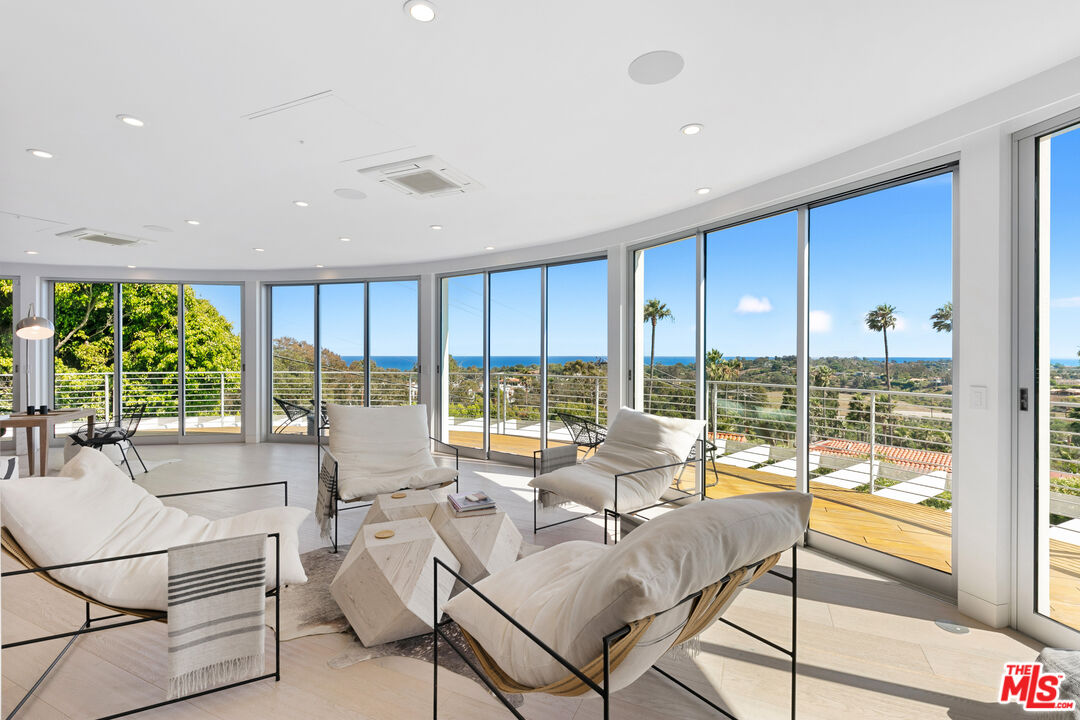 6375 Gayton Place Malibu, CA 90265 - Photo 13 of 49 a living room with furniture and a large window