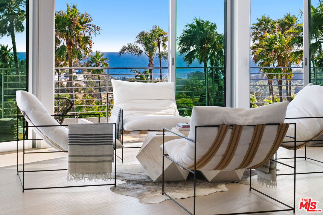 6375 Gayton Place Malibu, CA 90265 - Photo 14 of 49 a view of a patio with table and chairs and potted plants