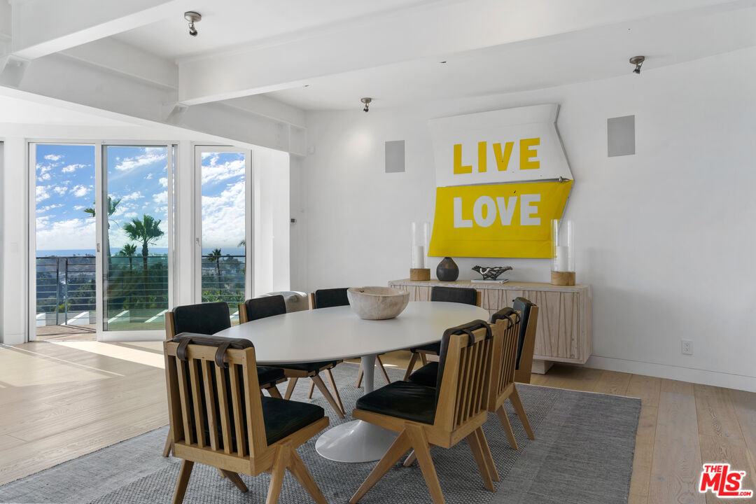 6375 Gayton Place Malibu, CA 90265 - Photo 17 of 49 a view of a dining room with furniture wooden floor and a potted plant