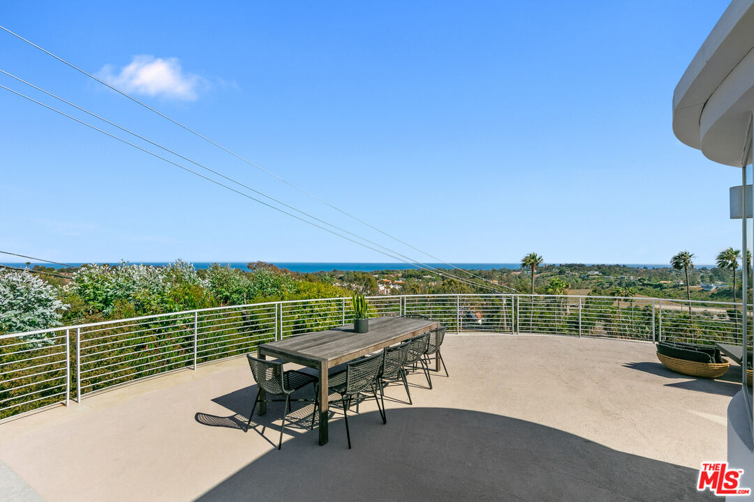 6375 Gayton Place Malibu, CA 90265 - Photo 23 of 49 a view of a lake with a terrace