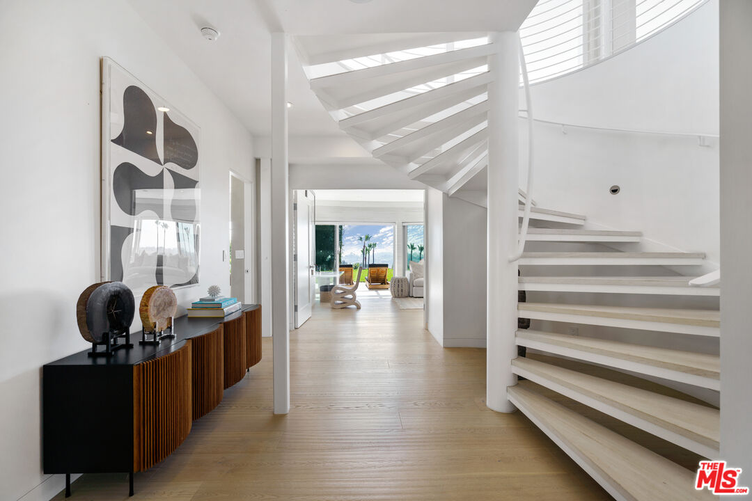 6375 Gayton Place Malibu, CA 90265 - Photo 28 of 49 a view of entryway and hall with wooden floor