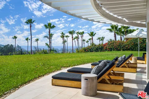 a spacious bedroom with a bed and a shower