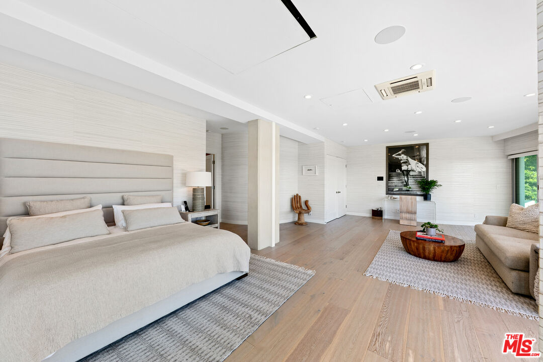 6375 Gayton Place Malibu, CA 90265 - Photo 34 of 49 a bedroom with furniture and a wooden floor