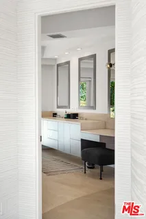 a bed room with a bed and a chair