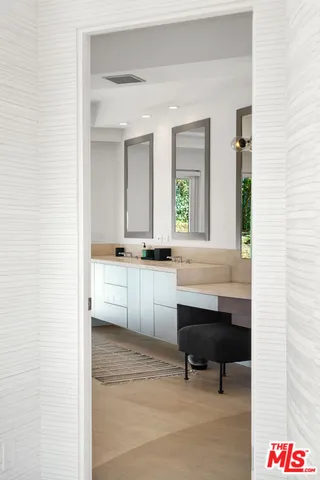 a bed room with a bed and a chair