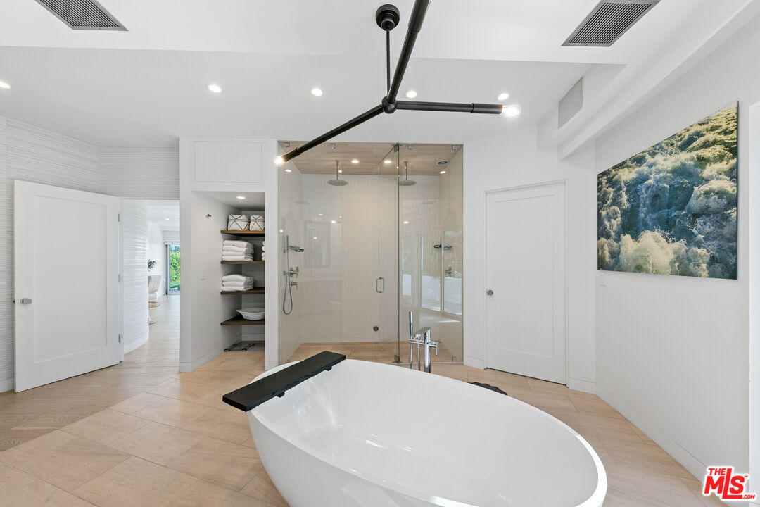 6375 Gayton Place Malibu, CA 90265 - Photo 36 of 49 a spacious bedroom with a bed and a shower