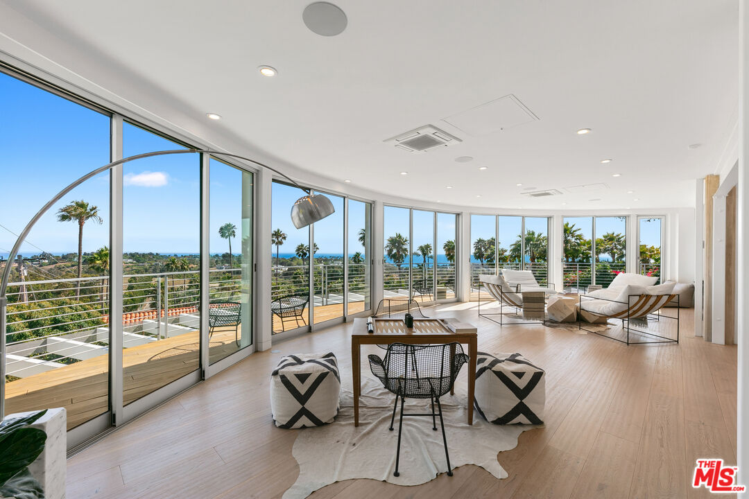 6375 Gayton Place Malibu, CA 90265 - Photo 4 of 49 a living room with furniture and a large window