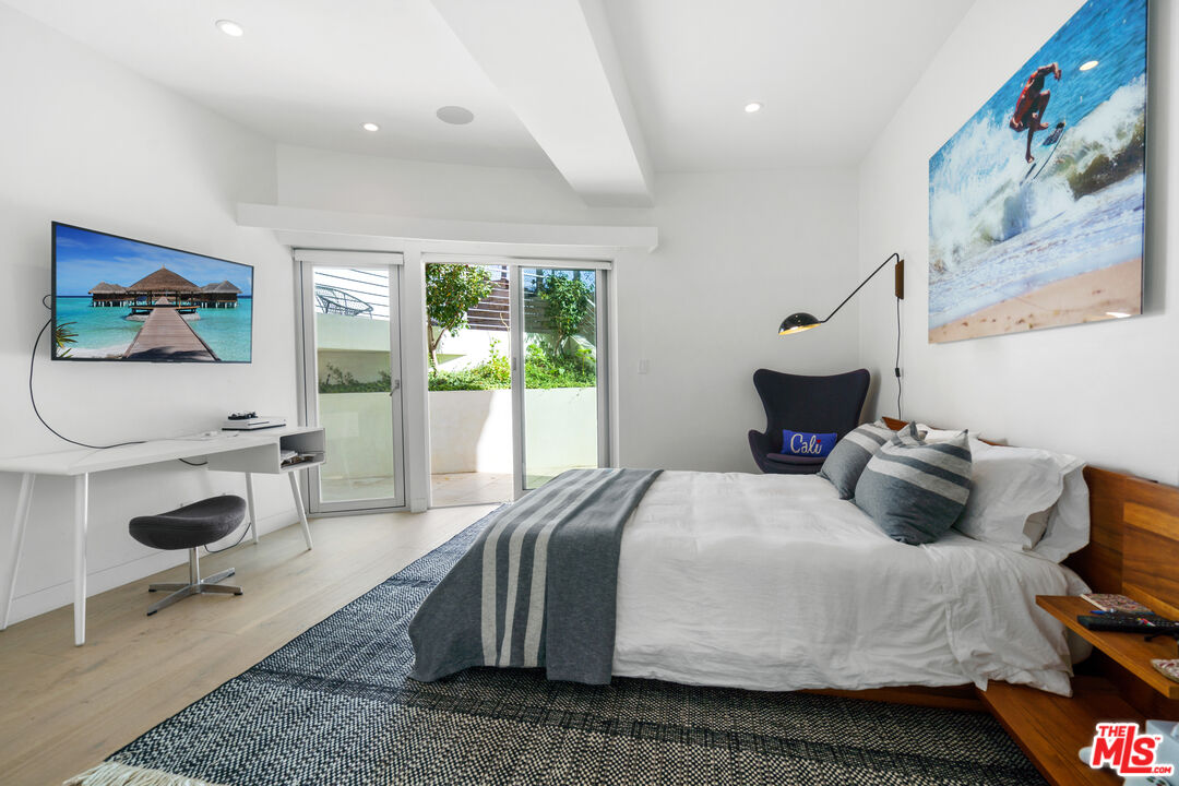 6375 Gayton Place Malibu, CA 90265 - Photo 42 of 49 a bedroom with a bed a chair and a large window