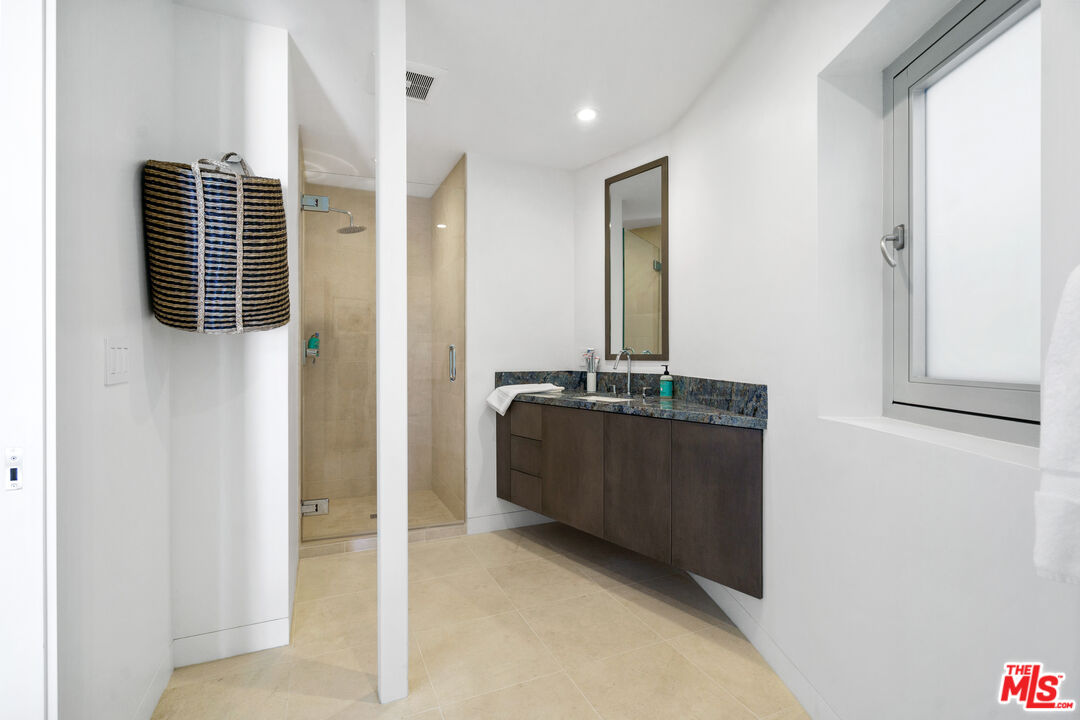 6375 Gayton Place Malibu, CA 90265 - Photo 45 of 49 a bathroom with a sink and mirror