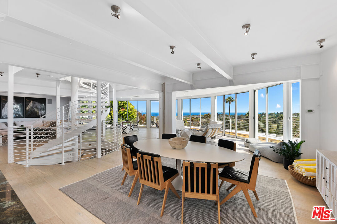 6375 Gayton Place Malibu, CA 90265 - Photo 6 of 49 a view of a dining room with furniture window and wooden floor