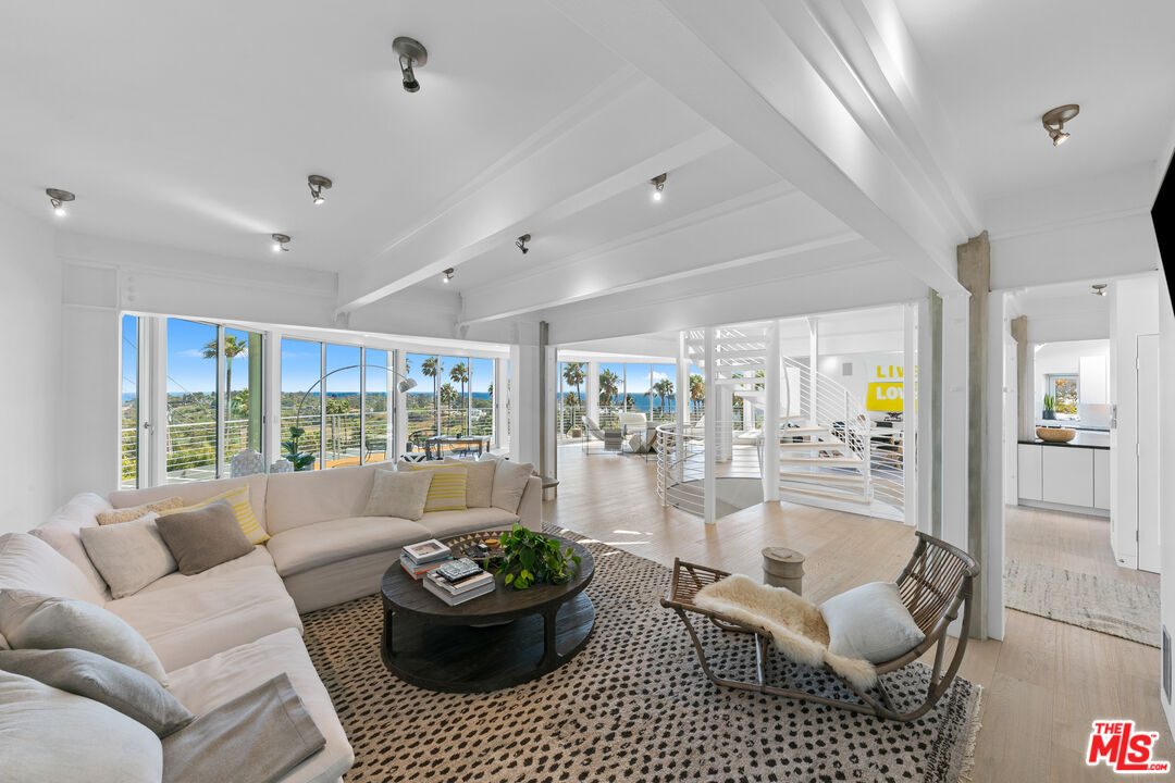 6375 Gayton Place Malibu, CA 90265 - Photo 8 of 49 a living room with furniture and a large window