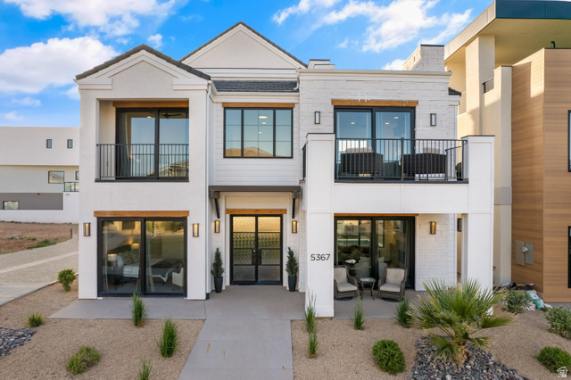 5367 Cyan Lane St. George, UT 84790 - Photo 1 of 49 Modern stucco and brick exterior featuring a prominent two-story design