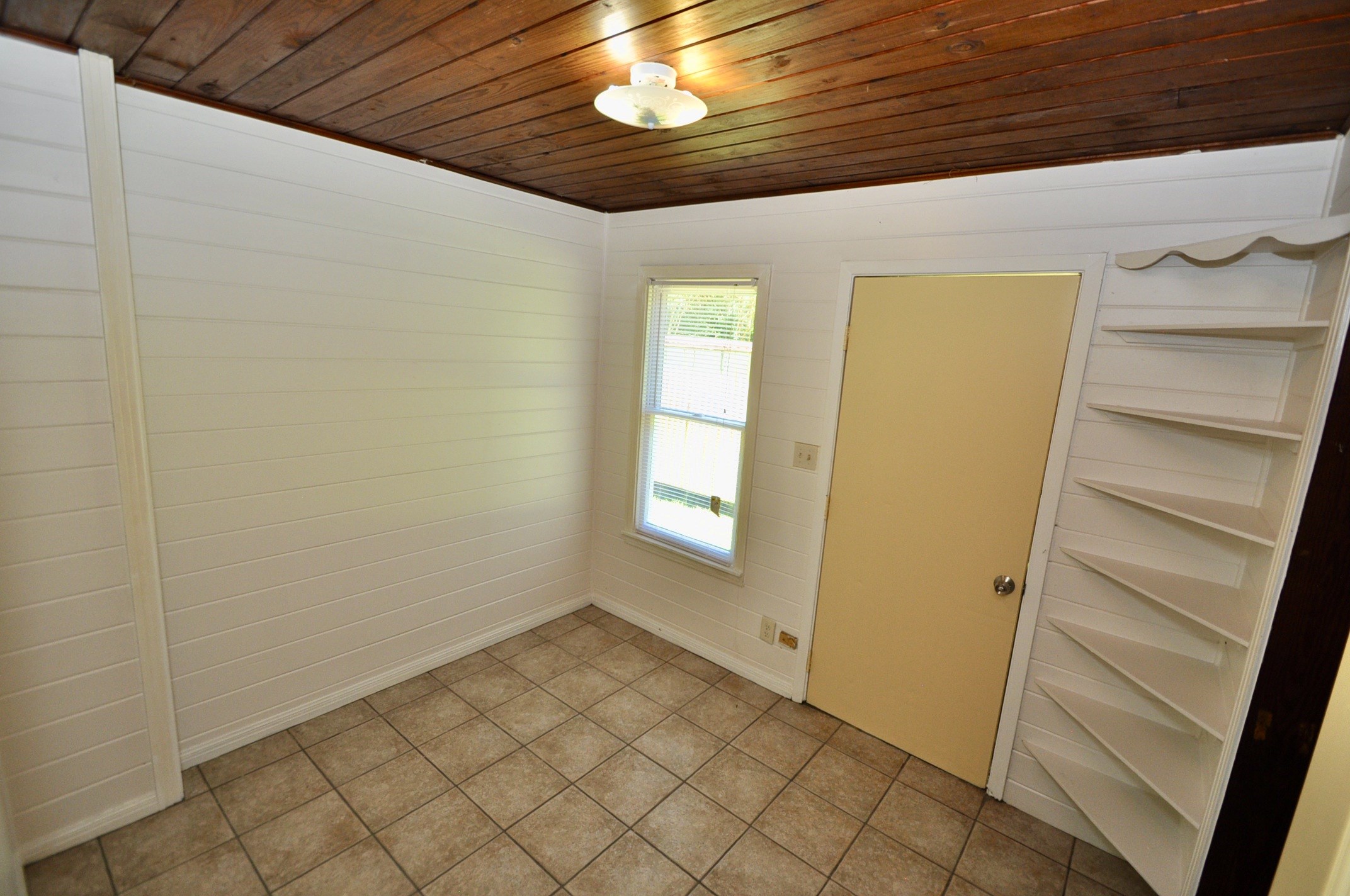 1807 Bell Street Dayton, TX 77535 - Photo 12 of 34 a view of room with window and chandelier