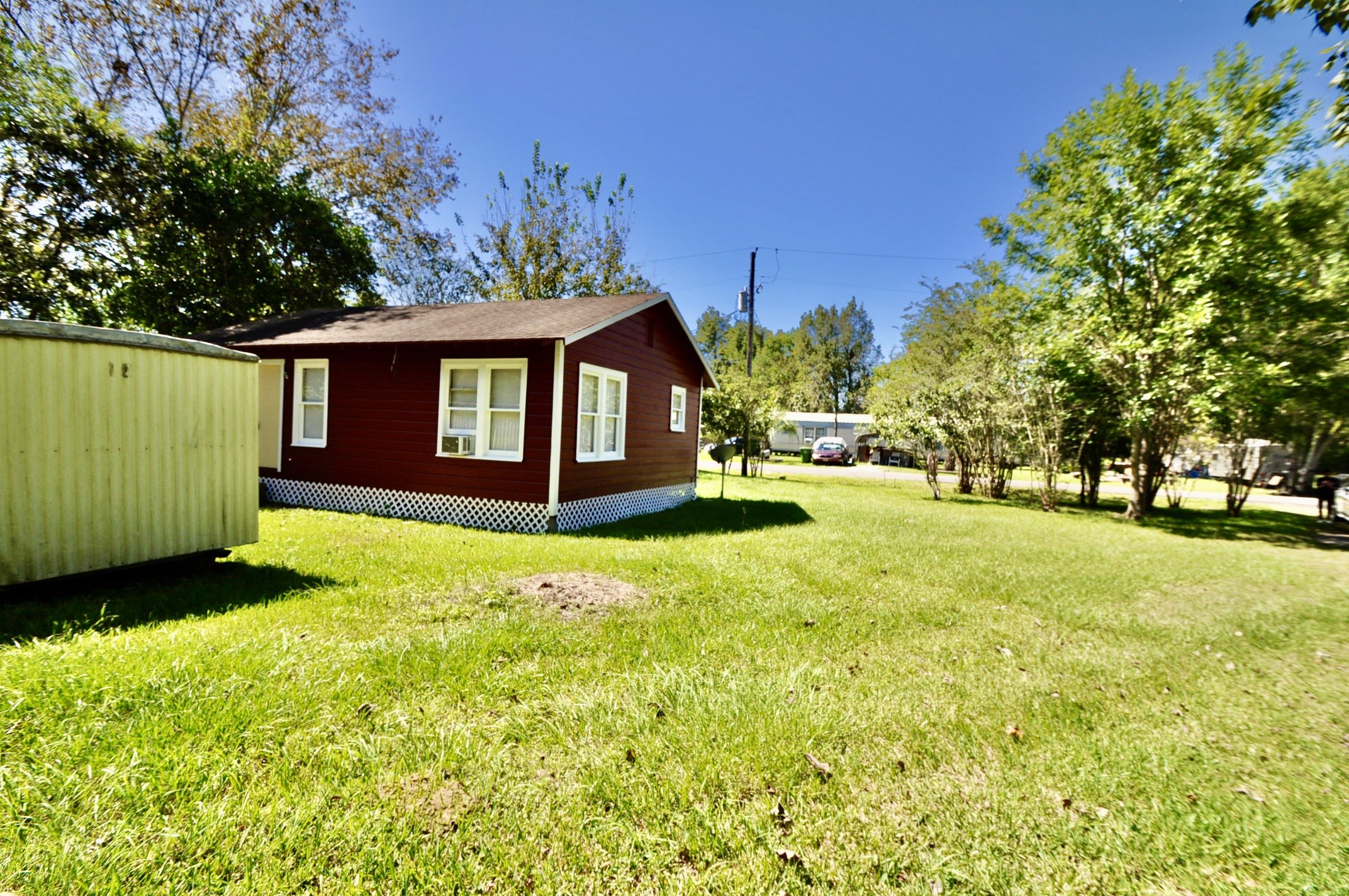 1807 Bell Street Dayton, TX 77535 - Photo 2 of 34 a front view of a house with a yard