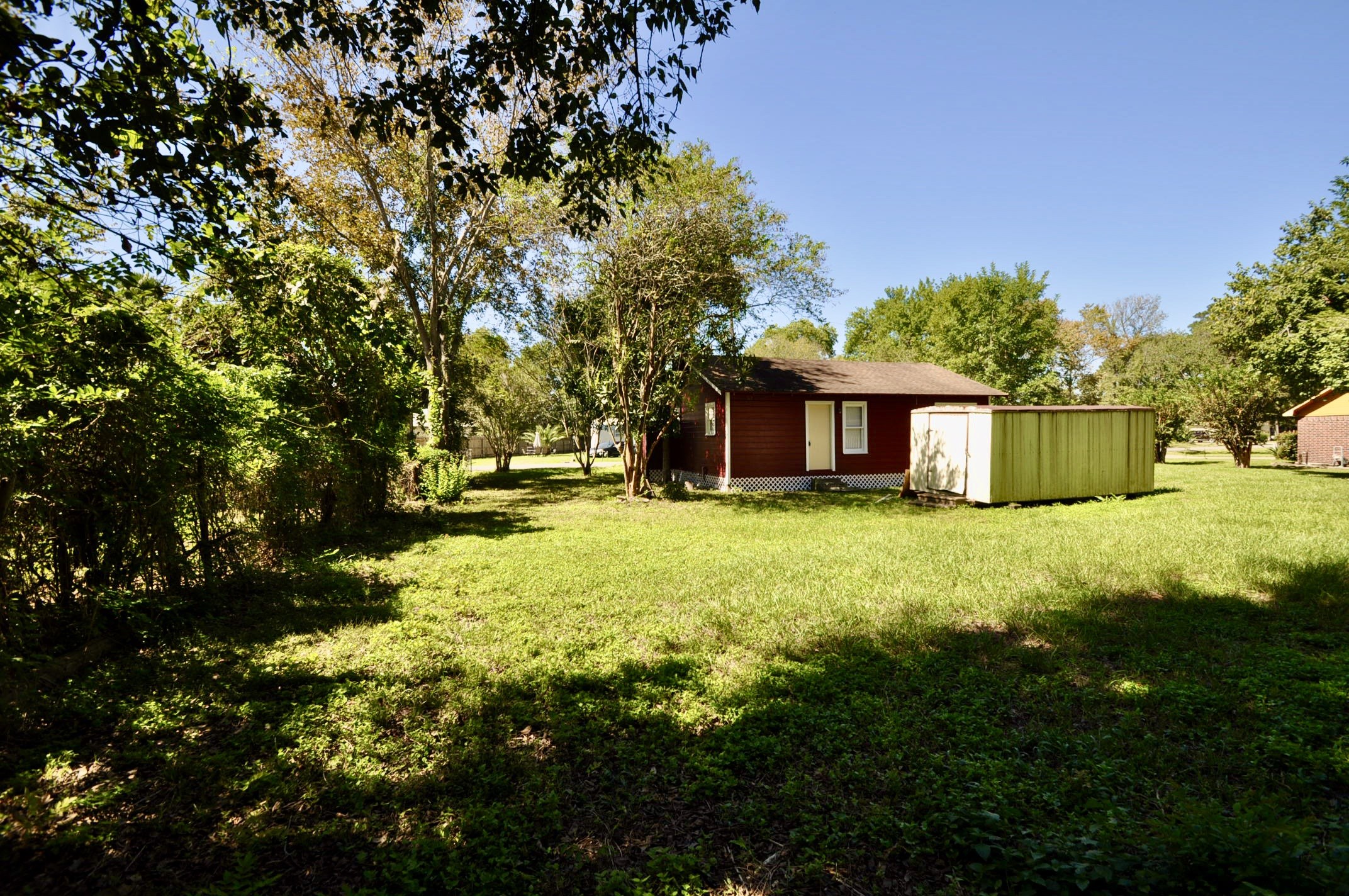 1807 Bell Street Dayton, TX 77535 - Photo 8 of 34 a front view of a house with a yard
