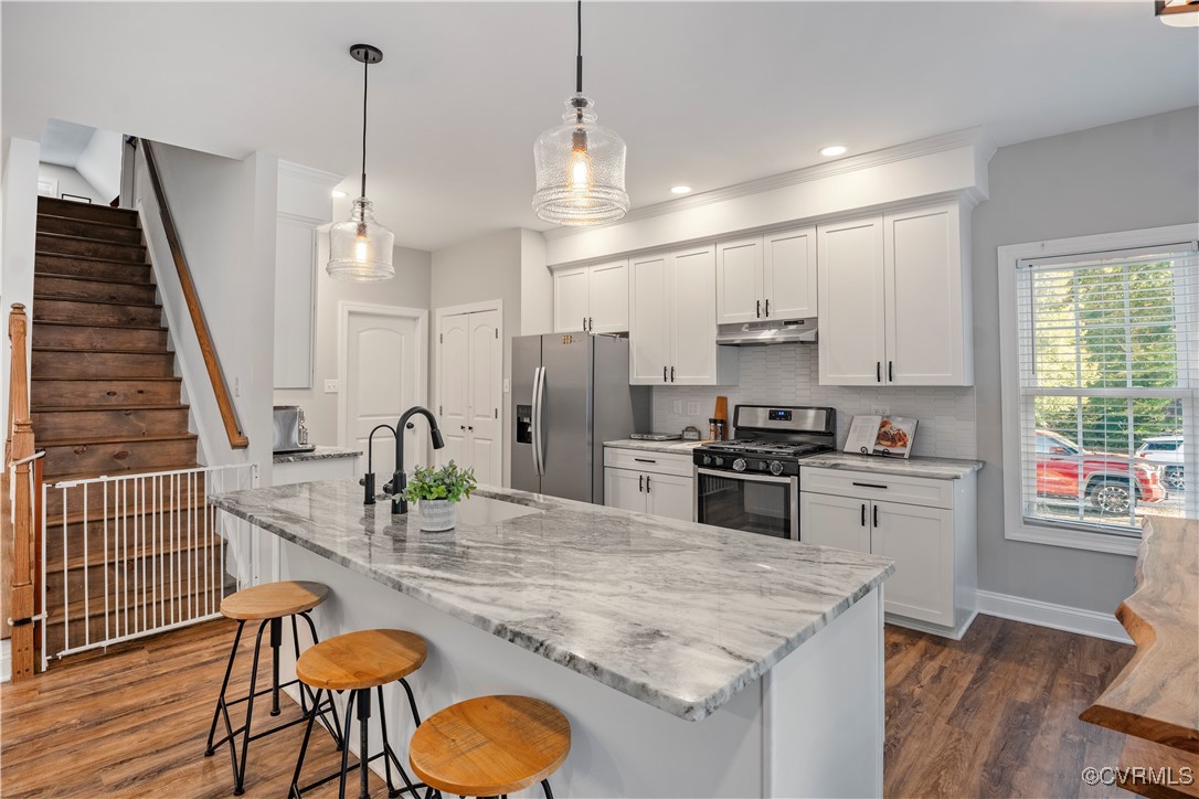 6310 Rock Run Road Chesterfield, VA 23832 - Photo 11 of 38 a kitchen with stainless steel appliances granite countertop a stove refrigerator and cabinets