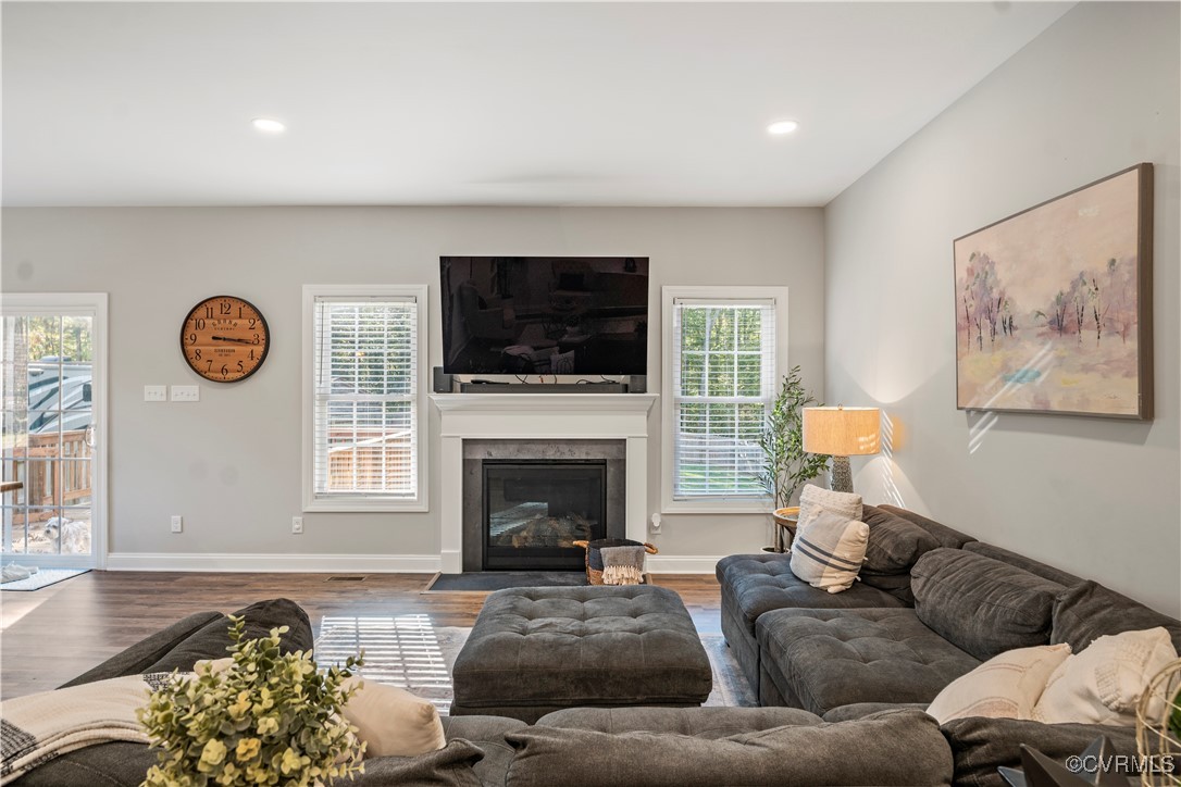 6310 Rock Run Road Chesterfield, VA 23832 - Photo 16 of 38 a living room with furniture a fireplace and a flat screen tv
