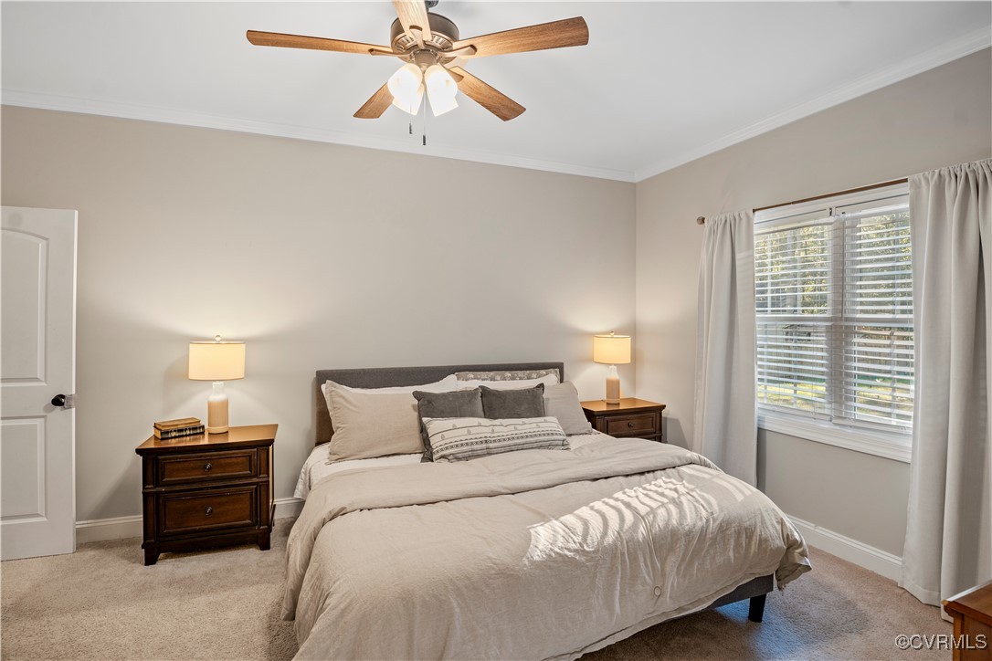 6310 Rock Run Road Chesterfield, VA 23832 - Photo 20 of 38 a bedroom with a bed and a chandelier