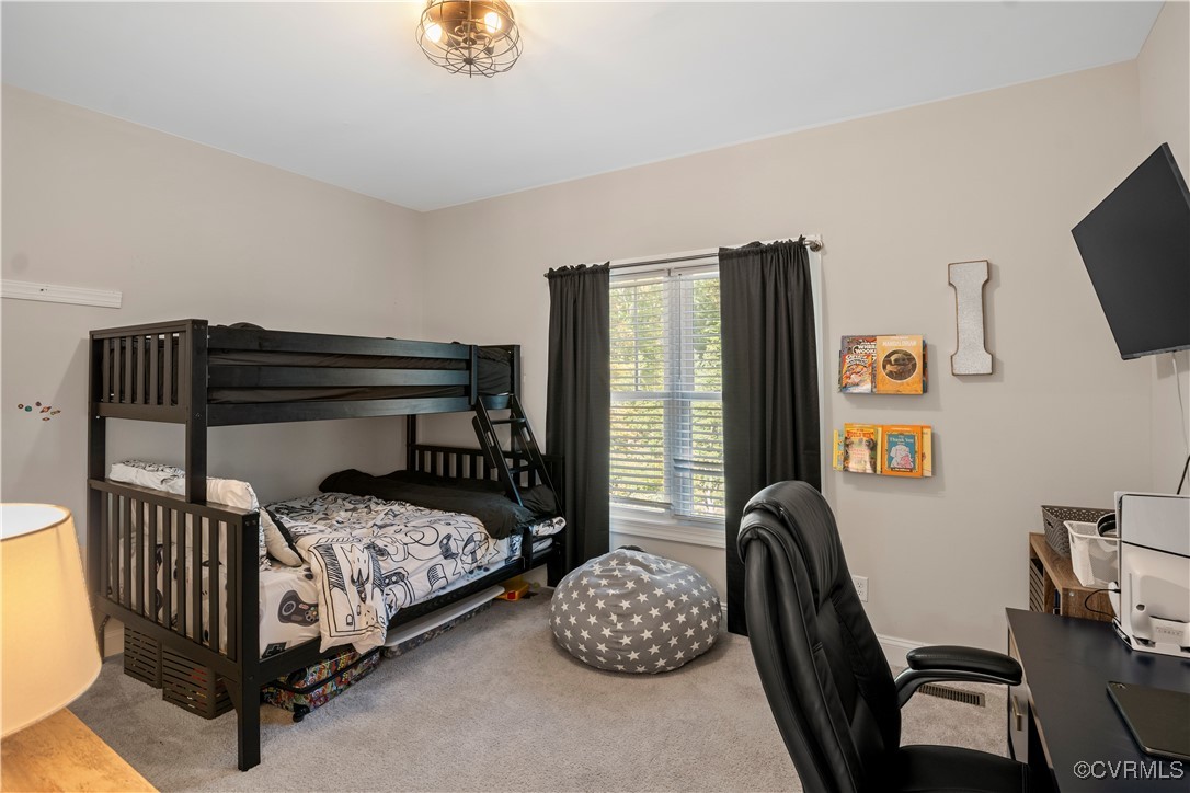 6310 Rock Run Road Chesterfield, VA 23832 - Photo 25 of 38 a bedroom with a bed and a tv