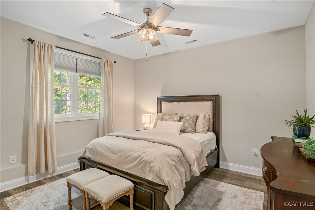 6310 Rock Run Road Chesterfield, VA 23832 - Photo 32 of 38 a bedroom with a bed and a chair with the potted plant
