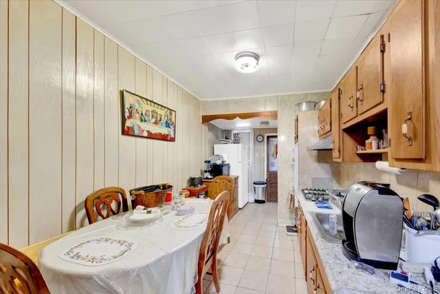 a very nice looking dining room with a table and chairs