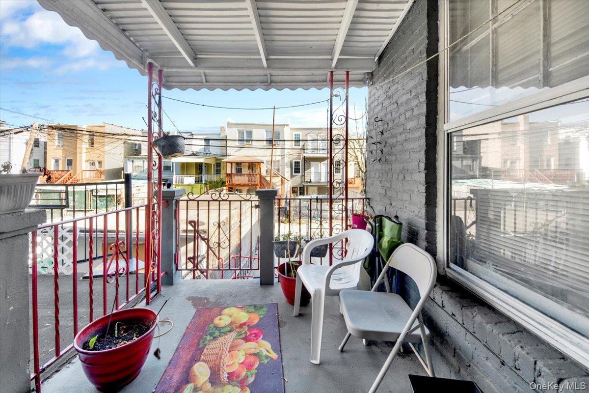 1238 Colgate Avenue Bronx, NY 10472 - Photo 18 of 20 a living room with furniture and a potted plant