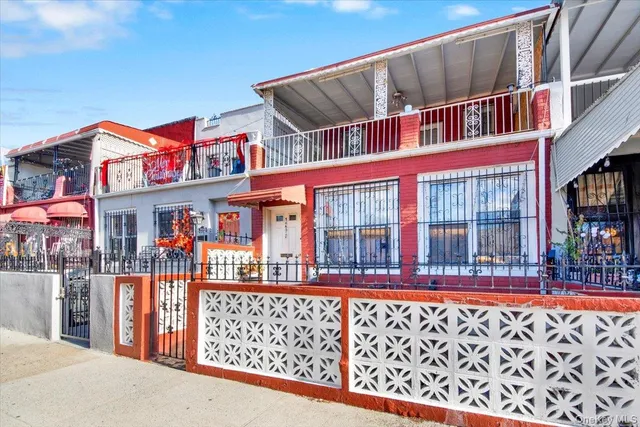 a front view of a building with glass windows