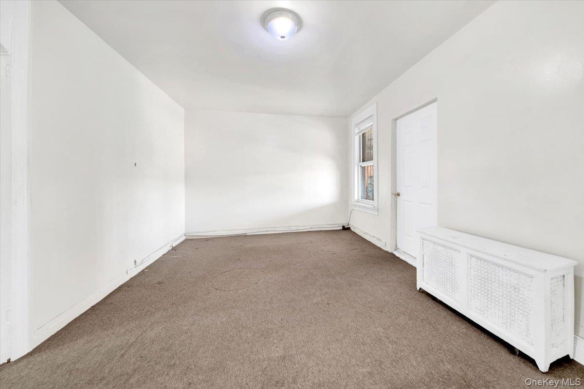 1238 Colgate Avenue Bronx, NY 10472 - Photo 3 of 20 an empty room with windows
